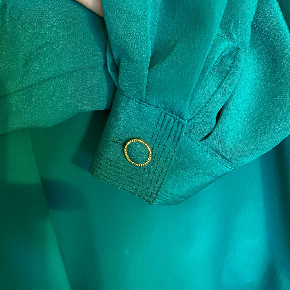 From Paris France, chic and silky teal blouse with decorative buttons and cuffs